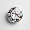 Olexandra_One_round_diamond_on_a_white_grey_background_high-r_a17a96eb-4386-4093-a5e9-328e6a2f6157_0 1